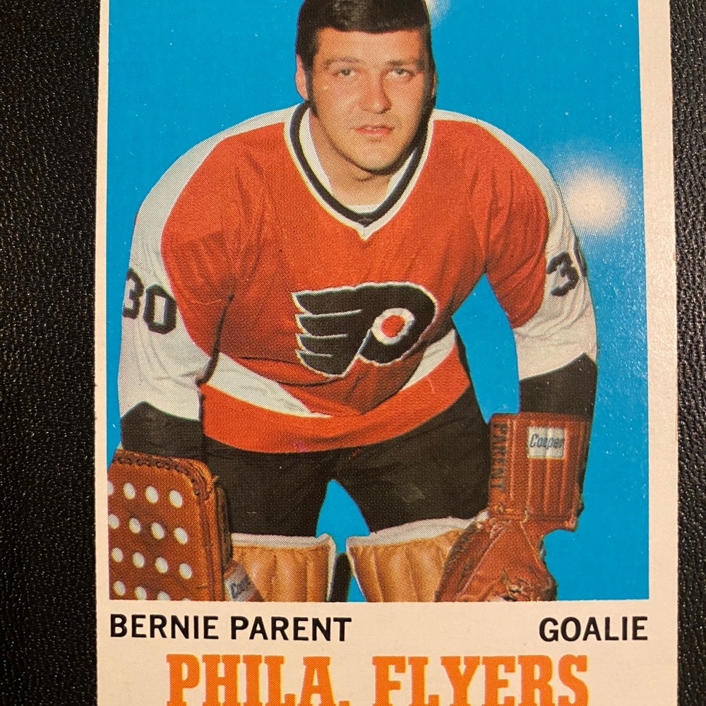 Topps Hockey Card with Red Jersey and Brown Gear